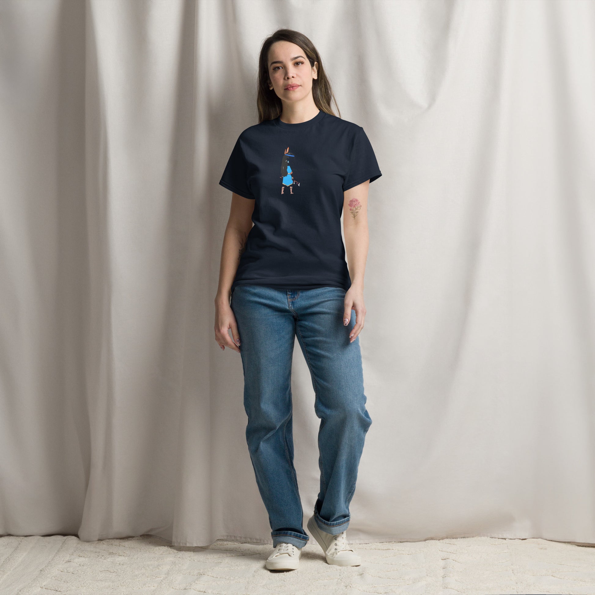 Front view of a lady model wearing a navy t-shirt with an American Indian woman graphic design on a beige background