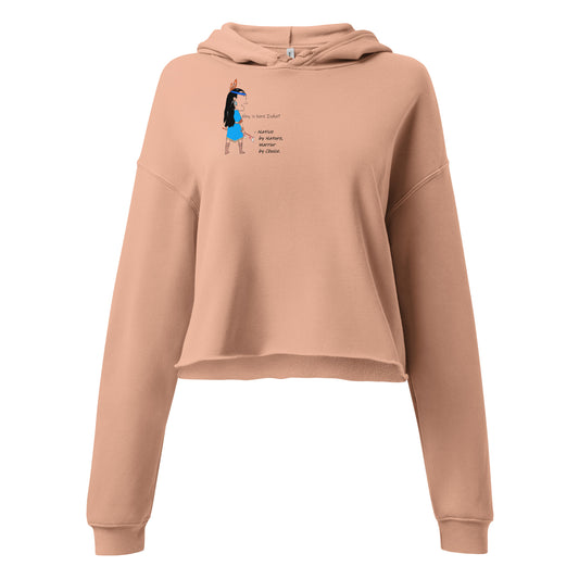 Front view of a peach cropped hoodie with an American Indian woman graphic design on a white background