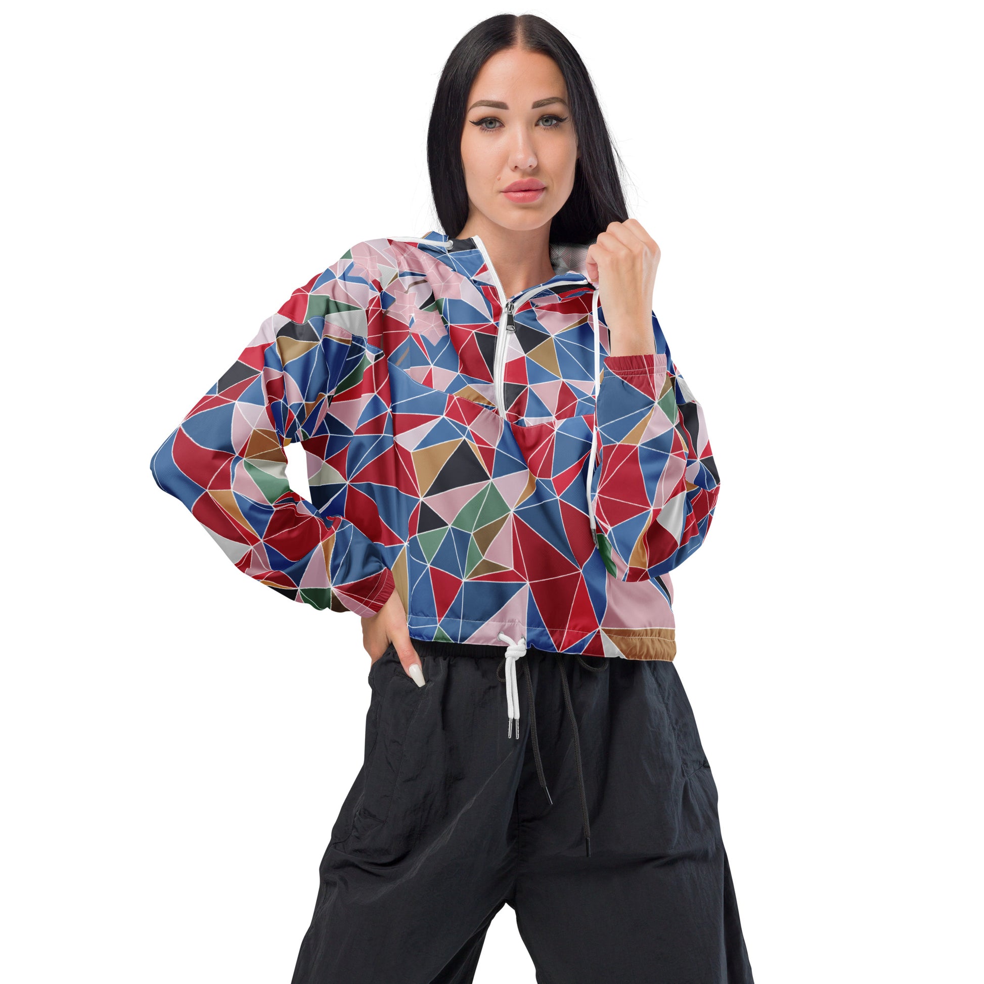 Woman wearing a colorful geometric-patterned jacket with spring cherry blossom graphic on a white background