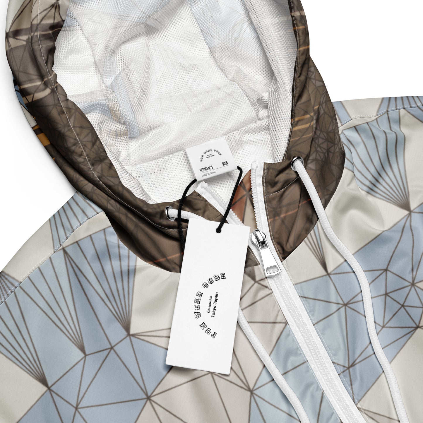 A geometric patterned windbreaker with a Fun Wear Code tag in a  white background
